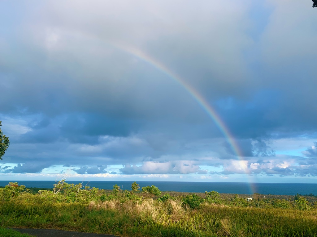 Rainbow over the Red Road coastal drive, Lower Puna